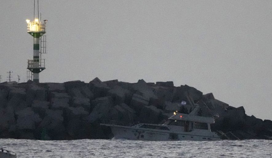 Israeli naval forces sail a confiscated Gaza-bound flotilla boat into Israel's Ashdod port after intercepting the vessel on the Mediterranean Sea, Tuesday, May 19, 2026. (AP Photo/Ariel Schalit)