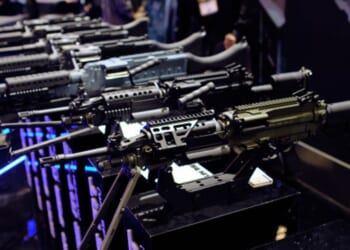Rows of rifles sit at a gun expo on May 8, 2026.