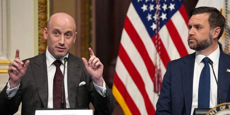 White House Deputy Chief of Staff Stephen Miller, left, speaks as Vice President J.D. Vance looks on during a roundtable discussion on anti-fraud initiatives Tuesday. Miller said the U.S. could balance the federal budget by eliminating all of the fraud in government programs.