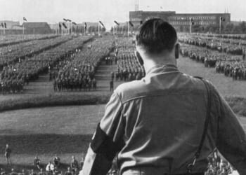 German Fuhrer and Nazi leader Adolf Hitler addresses soldiers with his back facing the camera at a Nazi rally in Dortmund, Germany.