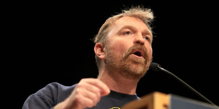 Democratic Senate candidate Graham Platner speaks at a “Fighting Oligarchy” tour stop held by Sen. Bernie Sanders at the Collins Center for the Arts on the University of Maine campus on May 24, 2026, in Orono, Maine.