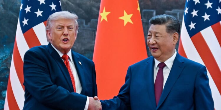 President Donald Trump shakes hands with China's President Xi Jinping at the Great Hall of the People in Beijing on May 14, 2026.