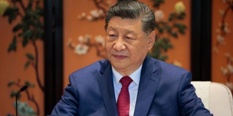 President Xi Jinping of China sits in a meeting room as he looks to the press during President Trump’s state visit to China on May 15, 2026.