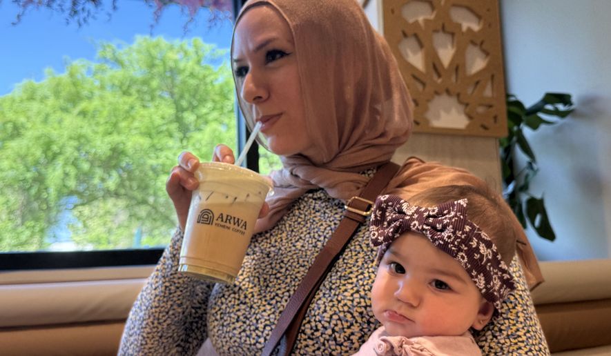 Hanan Jomaa drinks an iced pistachio latte inside Arwa Yemeni Coffee on April 6, 2026 in Sunnyvale, Calf. (AP Photo/Haven Daley)