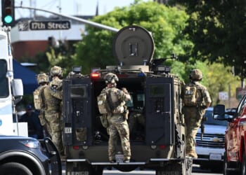 Standoff with bomb-carrying man enters second day at California bank