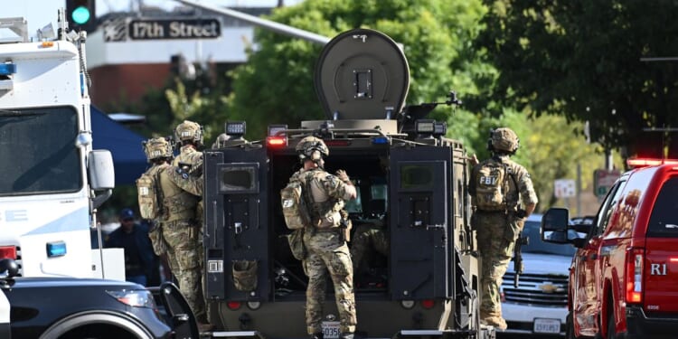 Standoff with bomb-carrying man enters second day at California bank