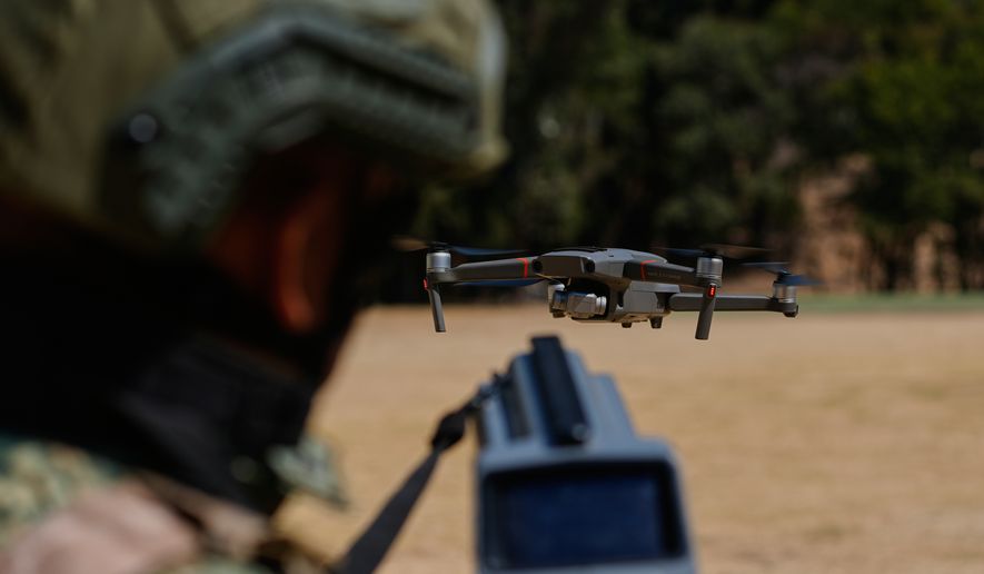 A soldier from the Mexican Army's anti-drone squadron displays equipment and tactics to be used during the 2026 FIFA World Cup, during a media presentation in Mexico City, Friday, Feb. 27, 2026. (AP Photo/Marco Ugarte)