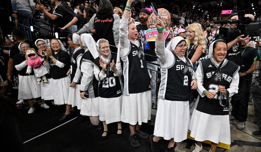 Nuns cheer before the first half of Game 6 in the Western Conference finals NBA basketball playoffs series between the San Antonio Spurs and the Oklahoma City Thunder, Thursday, May 28, 2026, in San Antonio. (AP Photo/Darren Abate)