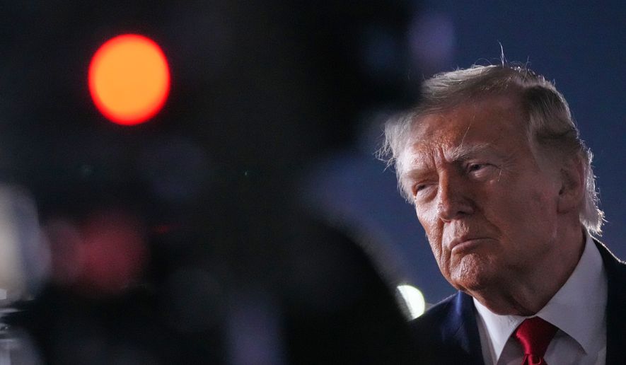 President Donald Trump talks with reporters before boarding Air Force One at John F. Kennedy International Airport in New York, early Tuesday, June 9, 2026. (AP Photo/Mark Schiefelbein)