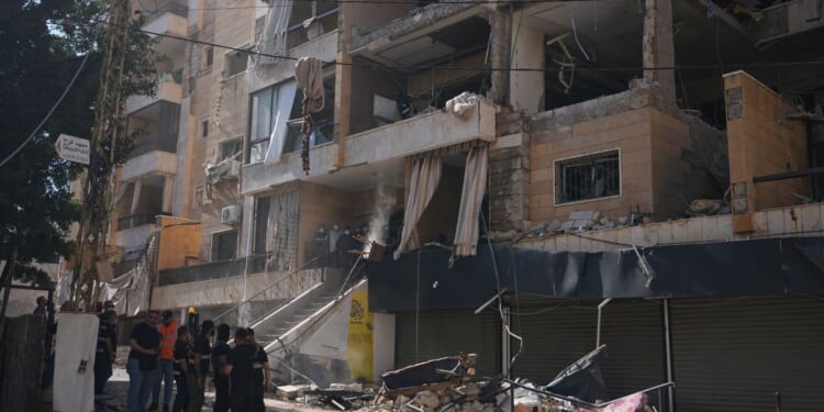 Israel continues assault in Lebanon despite threats of retaliation from Iran