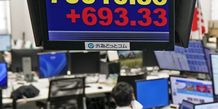 Oil drops below $80 per barrel, while tech stocks weigh on a mixed Wall Street