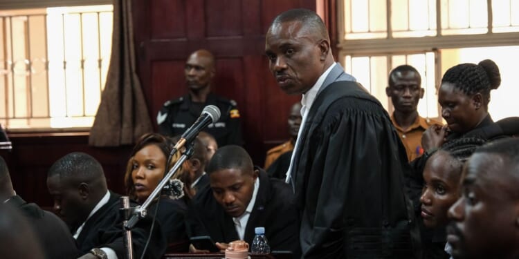 Uganda court charges lawyer for jailed Ugandan opposition leader with concealing treason