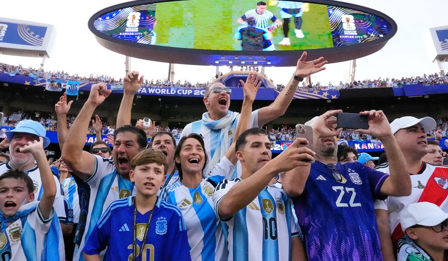 Argentinian fans react ahead of the World Cup Group J soccer match between Argentina and Algeria in Kansas City, Mo., Tuesday, June 16, 2026. (AP Photo/Charlie Riedel)