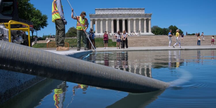 Blue coating is peeling off bottom of newly renovated Reflecting Pool