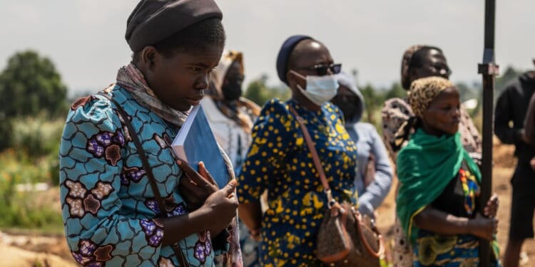 Mourners bury a 6-month-old Ebola victim in the Congo outbreak’s 3rd orphanage death