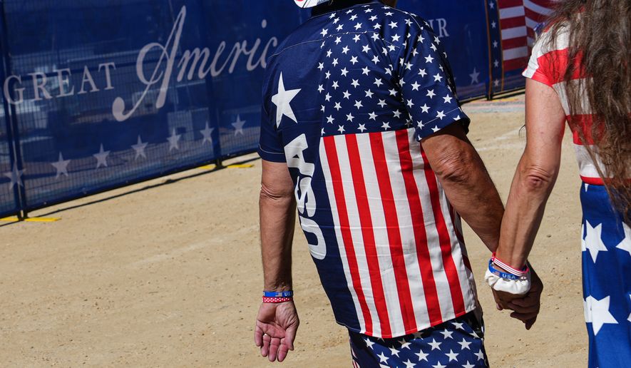 People arrive ahead of President Donald Trump's speech at the opening of the Great American State Fair on the National Mall, Wednesday, June 24, 2026, in Washington. (AP Photo/Julia Demaree Nikhinson)