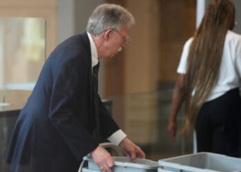 Former U.S. Ambassador to the United Nations and former National Security Advisor John Bolton walks through security as he arrives for a plea deal hearing at U.S. District Court for the District of Maryland on June 26, 2026 in Greenbelt, Maryland. Bolton is expected to plead guilty to one count of mishandling national security information. (Photo by Al Drago/Getty Images)