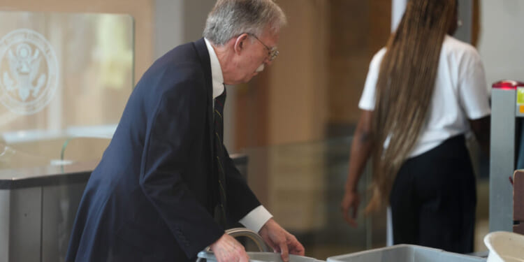 Former U.S. Ambassador to the United Nations and former National Security Advisor John Bolton walks through security as he arrives for a plea deal hearing at U.S. District Court for the District of Maryland on June 26, 2026 in Greenbelt, Maryland. Bolton is expected to plead guilty to one count of mishandling national security information. (Photo by Al Drago/Getty Images)