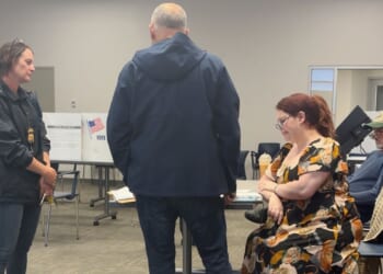 Election worker says federal officers confronted her at polls over social media post criticizing ICE