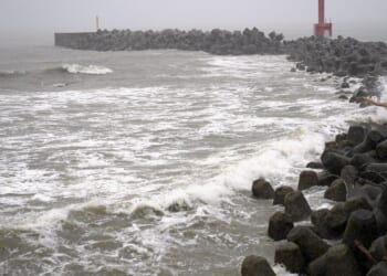 2 tropical storms pound Japan with floods and landslides, killing 1