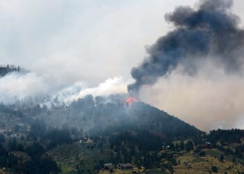 Smoke fills a mountain sky in a file photo from a 2012 wildfire in Colorado.