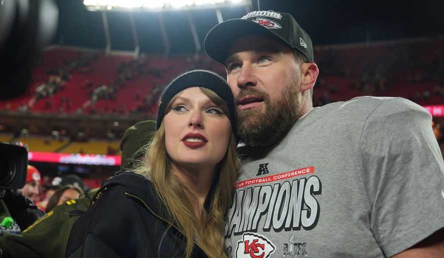 FILE - Kansas City Chiefs tight end Travis Kelce, right, is congratulated by Taylor Swift as they celebrate the Chiefs' victory over the Buffalo Bills in the AFC Championship NFL football game, Jan. 26, 2025, in Kansas City, Mo. (AP Photo/Charlie Riedel, File)