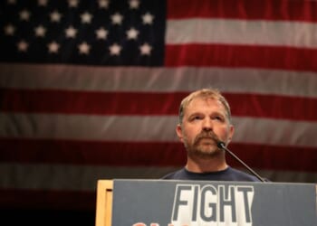 Democratic U.S. Senate candidate Graham Platner of Maine speaks May 24 at a “Fighting Oligarchy” tour stop held by Vermont Sen. Bernie Sanders in Orono, Maine.