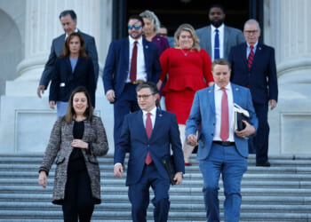 Speaker of the House Mike Johnson (R-LA) (C) walks out of the U.S. Capitol with Rep. Elise Stefanik (R-NY) (L) and Rep. Pat Fallon (R-TX) before delivering remarks.