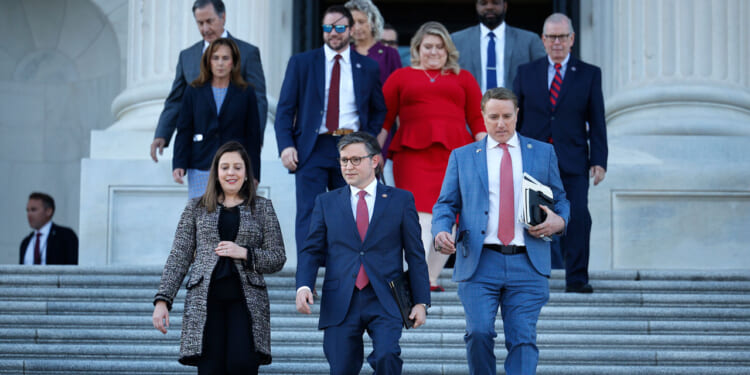 Speaker of the House Mike Johnson (R-LA) (C) walks out of the U.S. Capitol with Rep. Elise Stefanik (R-NY) (L) and Rep. Pat Fallon (R-TX) before delivering remarks.