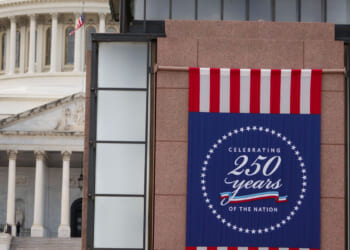 A banner for America's 250th celebration is displayed, with the U.S. Capitol in the background.