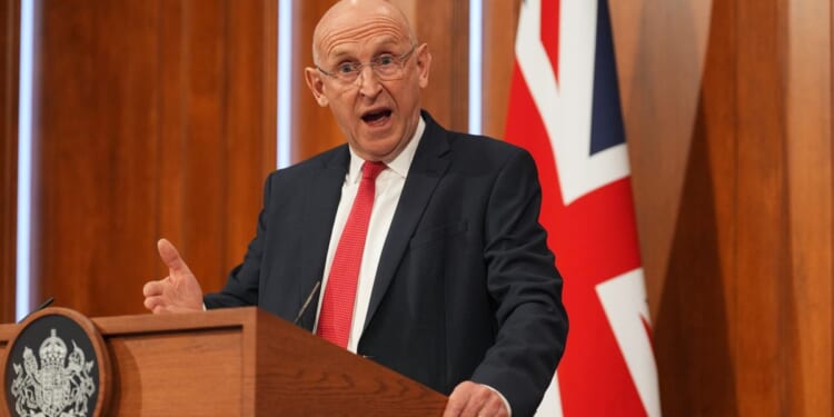 British defense minister resigns after losing battle for increased military spending
