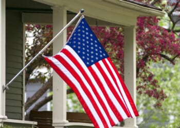 An American household has decided to mount their flag outside.