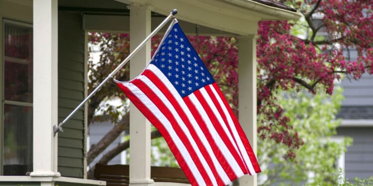 An American household has decided to mount their flag outside.