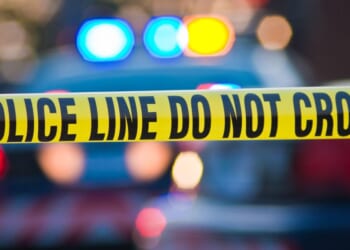 An image of police tape blocking off a crime scene.