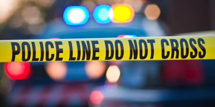 An image of police tape blocking off a crime scene.