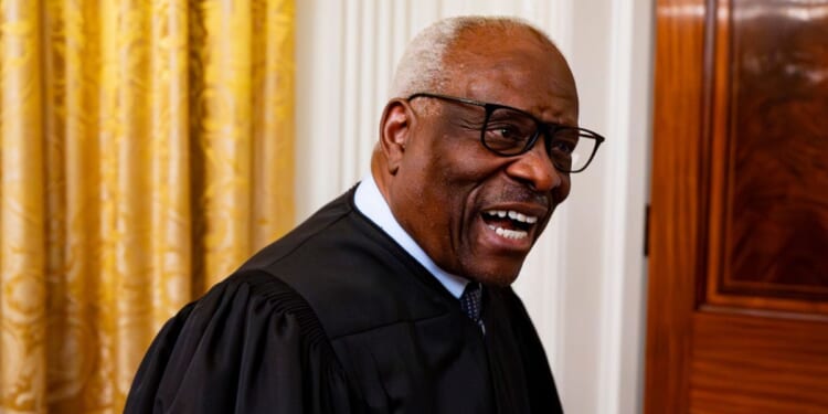 Associate Supreme Court Justice Clarence Thomas, seen in a May 22 photo, chuckled at a reporter's persistent questions Monday, but declined to answer.