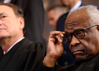 Supreme Court Associate Justices Samuel Alito and Clarence Thomas wait for their opportunity to leave the stage at the conclusion of the inauguration ceremonies in the Rotunda of the U.S. Capitol on Jan. 20, 2025, in Washington, D.C.