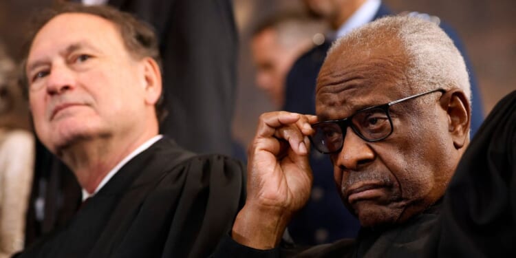 Supreme Court Associate Justices Samuel Alito and Clarence Thomas wait for their opportunity to leave the stage at the conclusion of the inauguration ceremonies in the Rotunda of the U.S. Capitol on Jan. 20, 2025, in Washington, D.C.