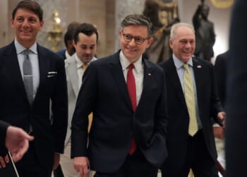 Speaker of the House Mike Johnson is shown leaving the House Chamber.