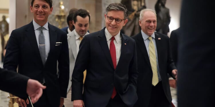 Speaker of the House Mike Johnson is shown leaving the House Chamber.