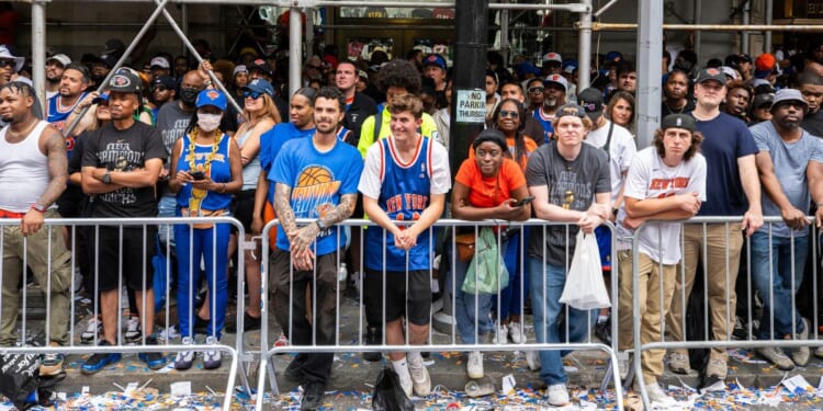 Fans look on during the New York Knicks Championship ticker tape parade and victory rally celebrating winning the 2026 NBA Finals on June 18, 2026, in New York City.