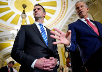 Senate Majority Leader John Thune accompanied by Sen. Tom Cotton.