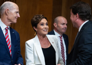 Sen. Rick Scott and Kari Lake arrive for a Senate Foreign Relations Committee hearing.