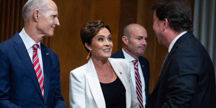 Sen. Rick Scott and Kari Lake arrive for a Senate Foreign Relations Committee hearing.