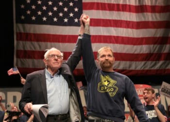 Sen. Bernie Sanders and Democratic U.S. Senate candidate Graham Platner stand together during a “Fighting Oligarchy” tour stop at the Collins Center for the Arts on the University of Maine campus on May 24, 2026, in Orono, Maine.