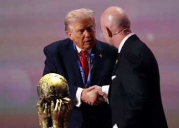 President Donald Trump receives the FIFA Peace Prize from Gianni Infantino, President of FIFA, during the FIFA World Cup 2026 Official Draw at John F. Kennedy Center for the Performing Arts on Dec. 5, 2025, in Washington, D.C.