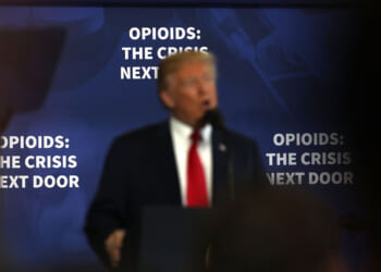 Donald Trump speaks to supporters and local politicians at an event at Manchester Community College.