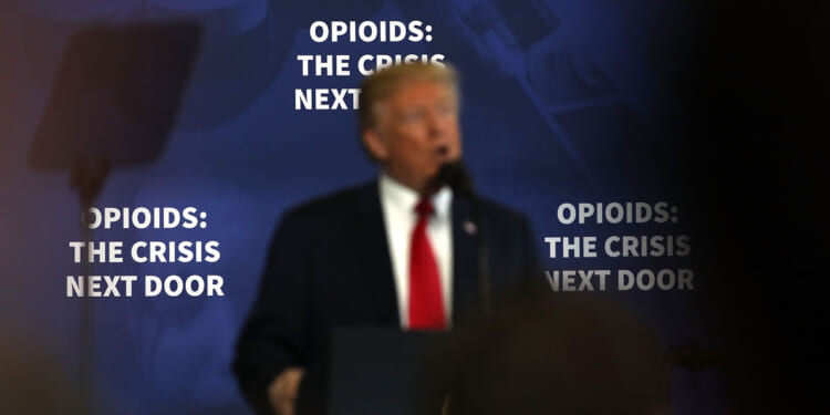 Donald Trump speaks to supporters and local politicians at an event at Manchester Community College.