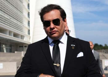 Former Rep. George Santos prepares to give a statement after a court hearing on Aug. 19, 2024, in West Islip, New York.