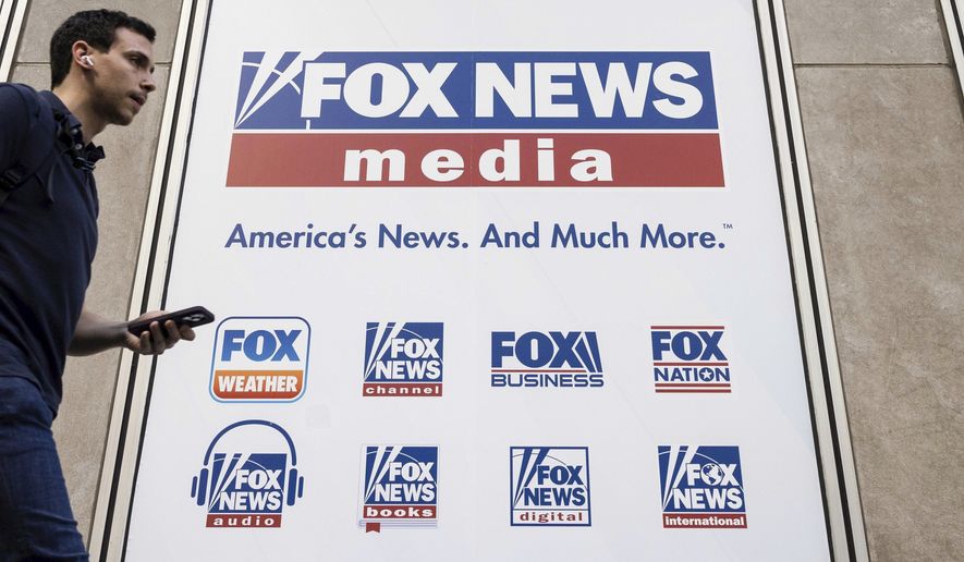 A person walks past the Fox News Headquarters in New York on April 12, 2023. (AP Photo/Yuki Iwamura, File)